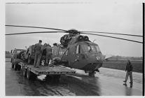 Helicopter and its Navy crew